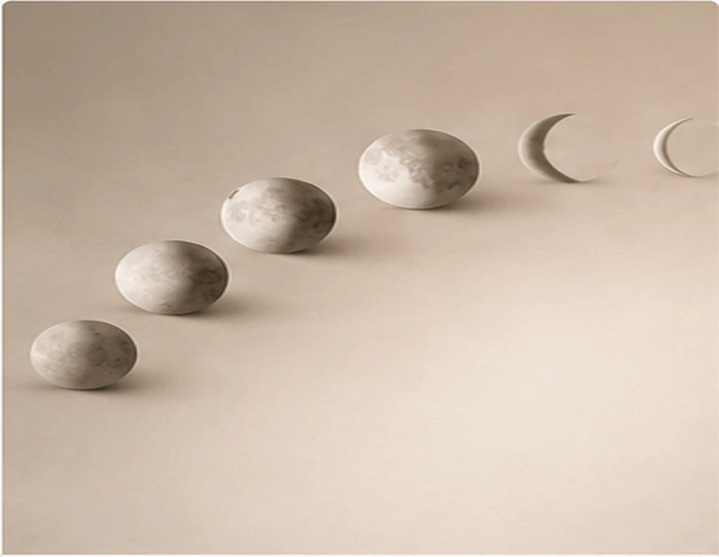 Moon phase objects on a neutral background